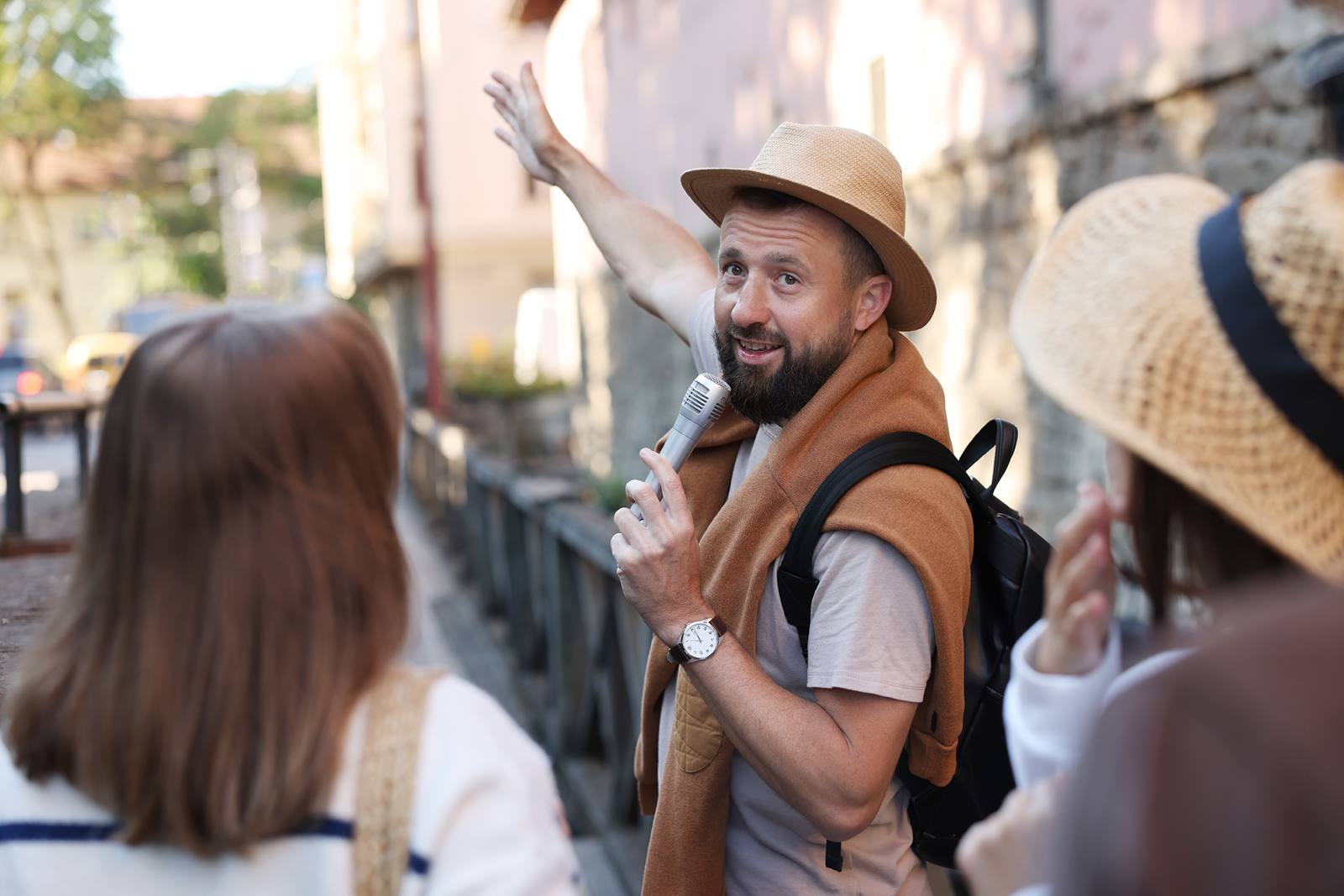 Tour guide with a group at a landmark